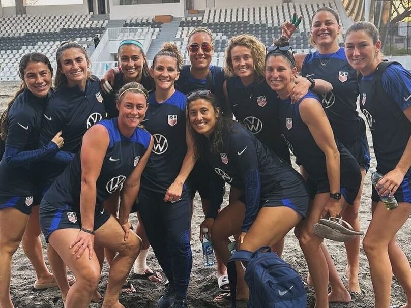 Ali surrounded by her US Beach Soccer team mates.